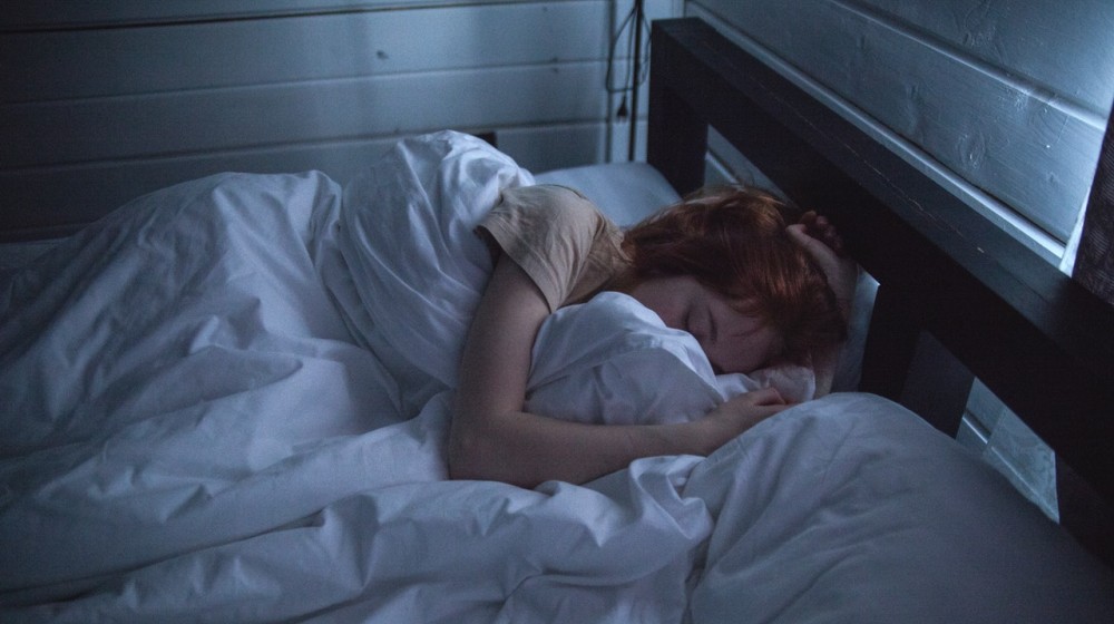woman sleeping | impact of sleep on mental health
