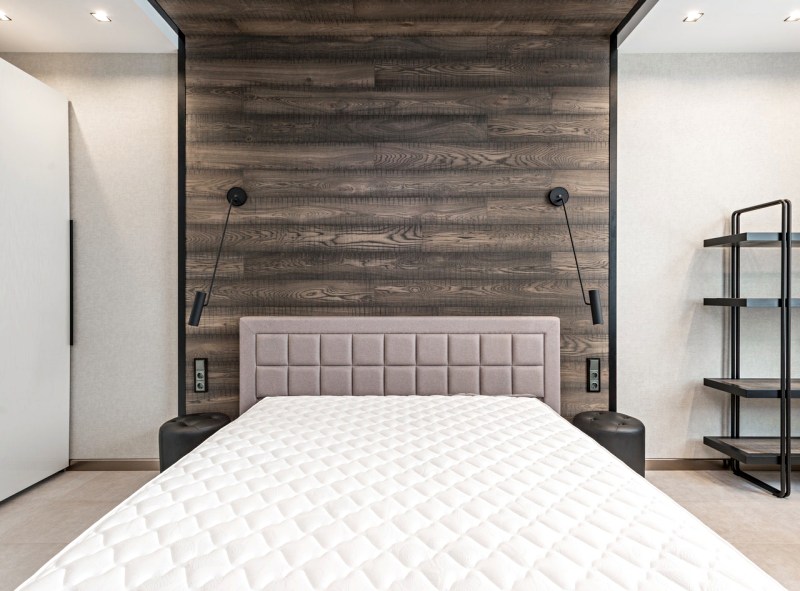 bed with mattress in bedroom | hybrid mattress vs memory foam