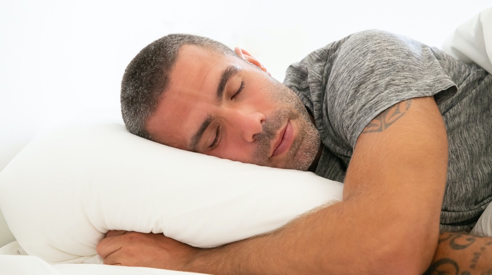 man in grey shirt | How To Improve Your Sleep Quality To Prevent Alzheimer's Disease | Featured