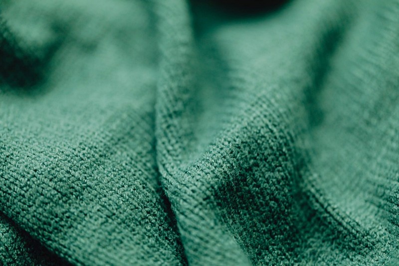 green textile in close up photography | bed sheets