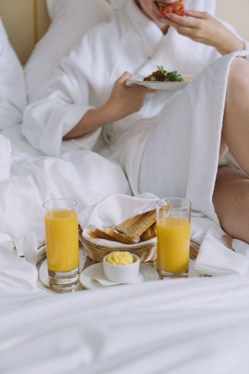 person having breakfast in bed | waterproof