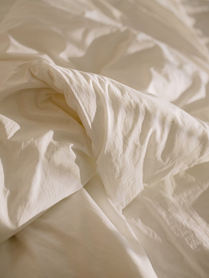 white textile on white textile | duvet