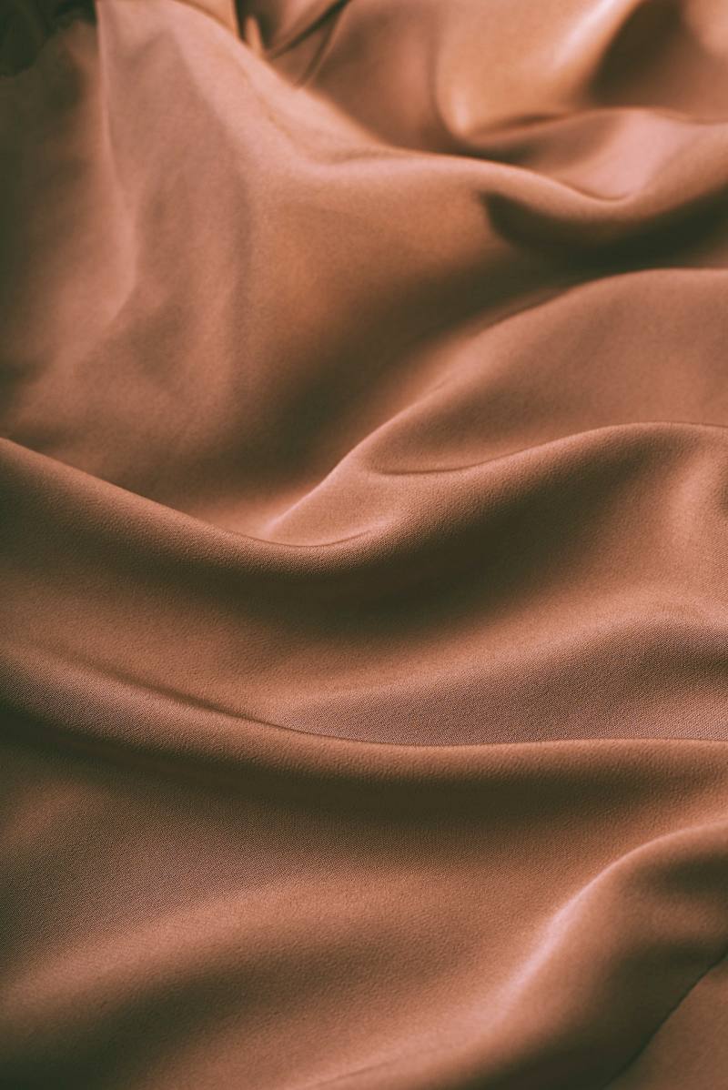 background of smooth rippled brown silk fabric | pima cotton