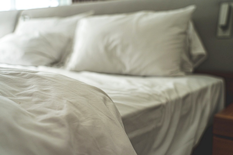 white bed with pillows | pillow