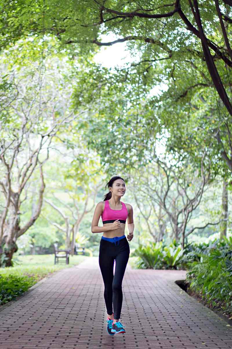 woman running on pathway | health