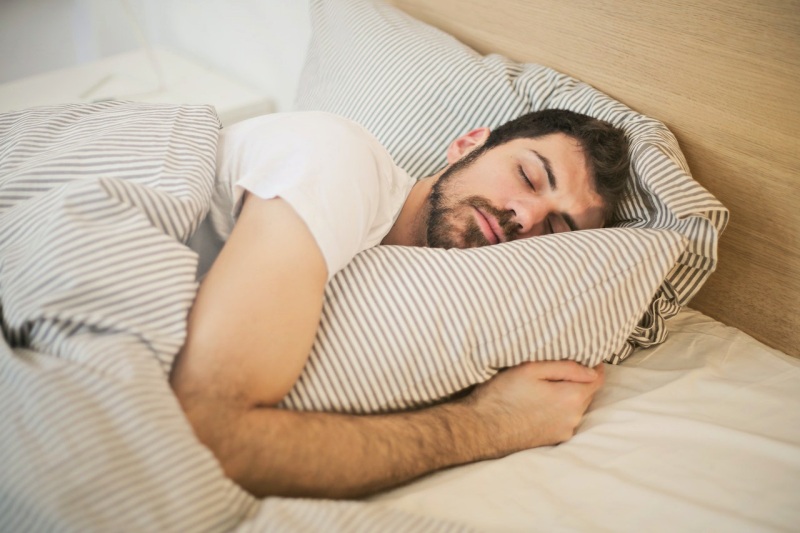 photo of sleeping man | firm mattress