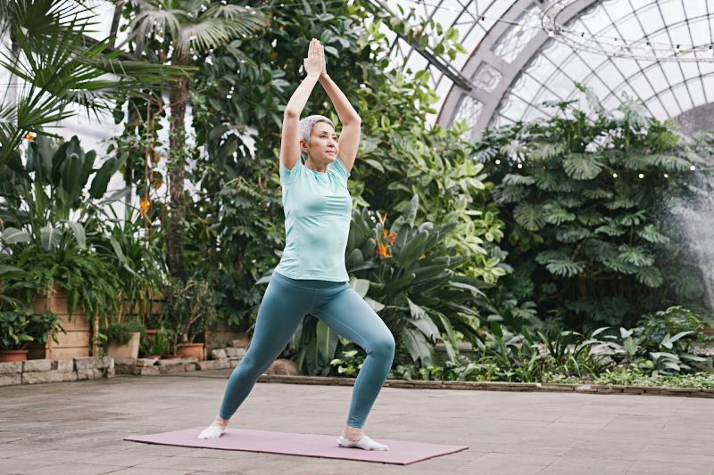 woman practicing yoga | health