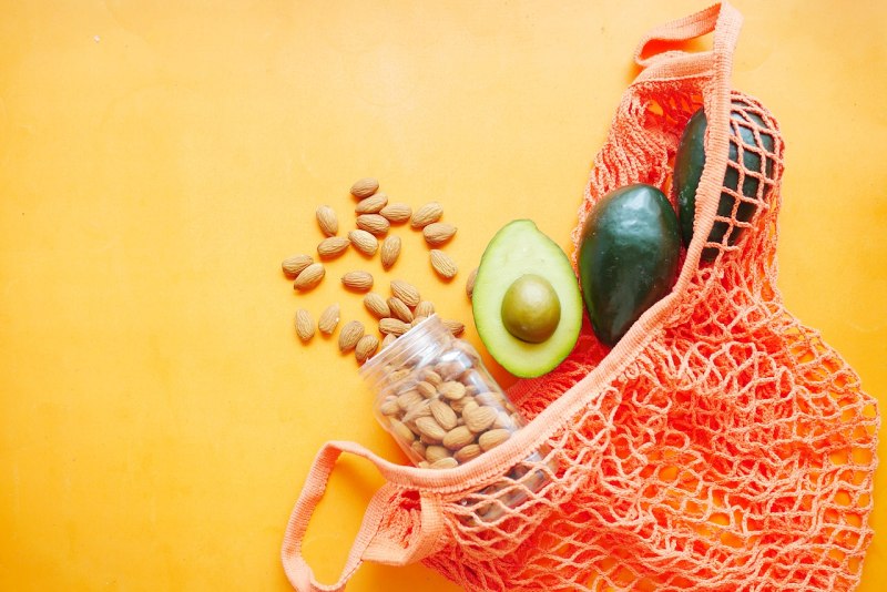 avocados and nuts on orange mesh bag | low carb diet