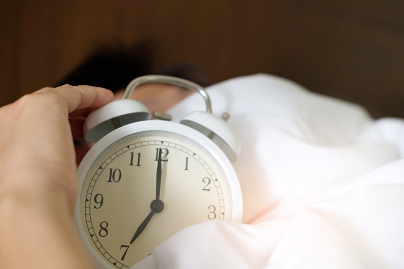 photo of person holding alarm clock | getting sleep