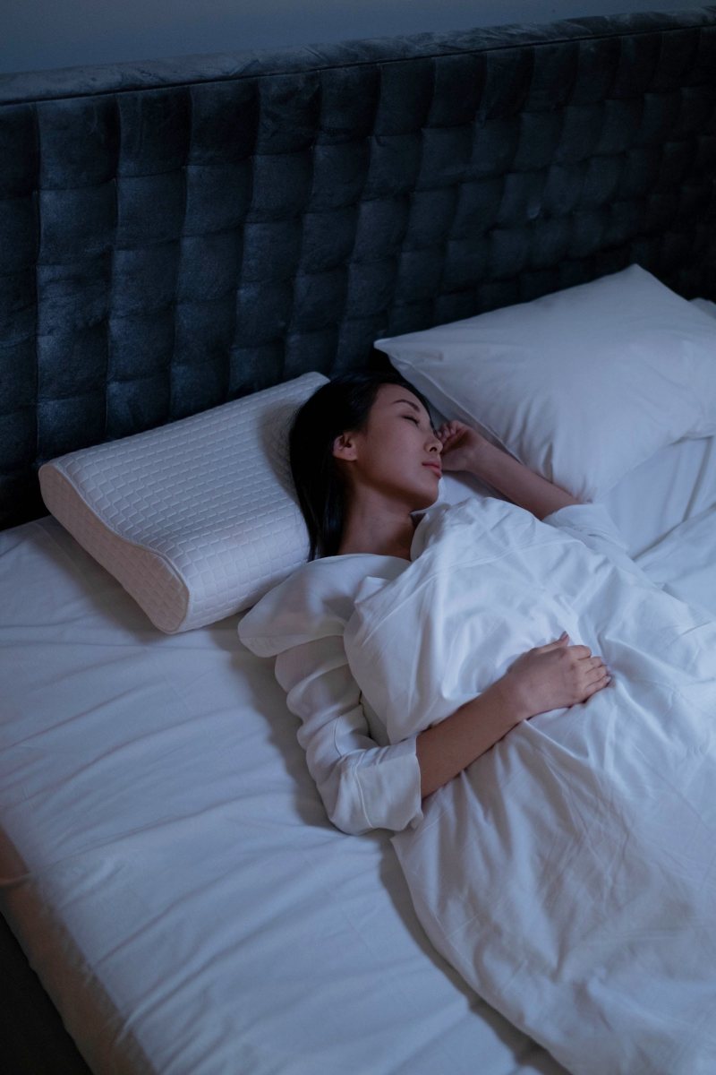 a woman sleeping in her bed | deep sleep