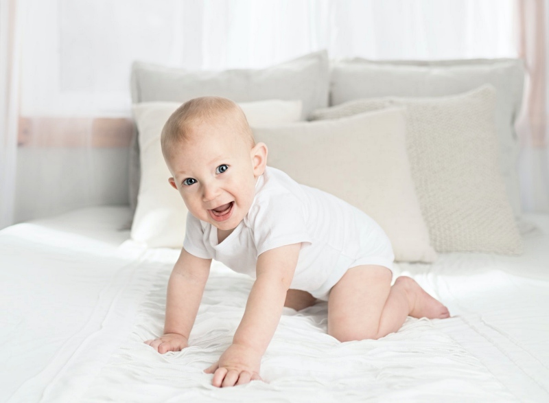 baby on bed | mattress for toddler