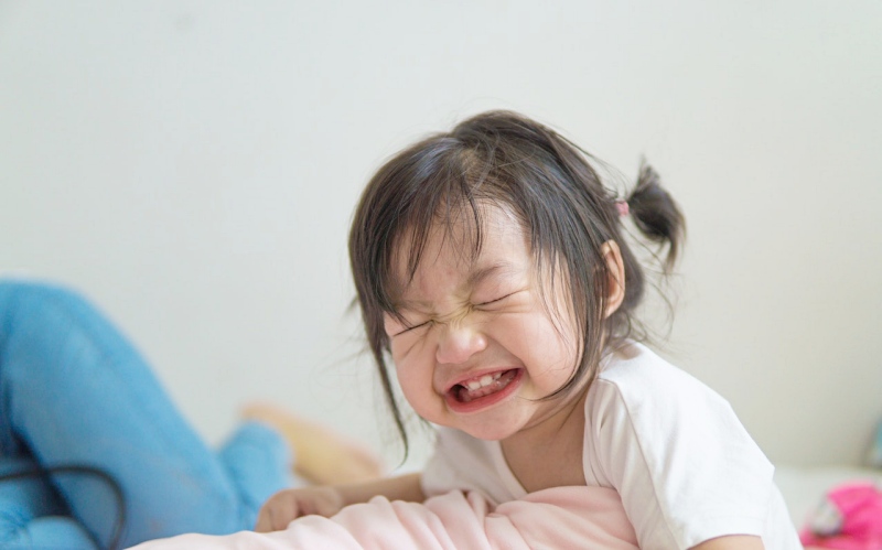 small asian girl with closed eyes | mattress for toddler